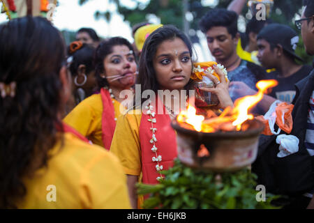 Woman hindu pilgrim with kavaldi walking to Batu Cave temple, Kuala Lumpur Malaysia during Thaipusam festival on 3rd FEB 2015. Stock Photo