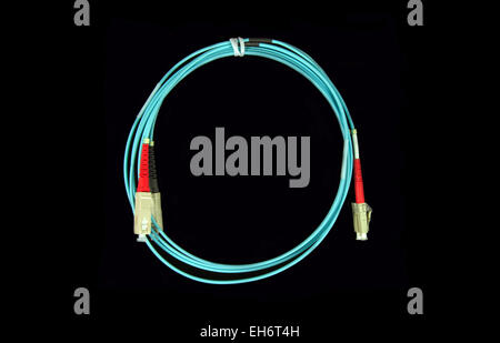Blue fiber patch cable with LC connectors in one end and SC connectors in  the other end Stock Photo