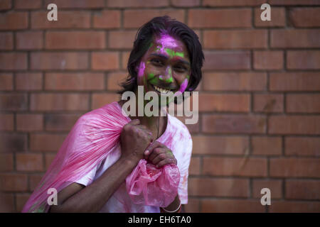 Dhaka, Bangladesh. 8th Mar, 2015. Dhaka, Bangladesh, 08 March 2015.Bangladeshi youth playing coloured powders during Holi celebrations at the Fine Arts Institute of Dhaka University. The Holi festival is celebrated to mark the onset of spring, with people from all walks of life coming out on the streets and applying coloured powder to anyone and everyone upon the advent of spring.Holi is the festival of colors, fun and frolic and is celebrated by millions of Hindus in the Indian subcontinent to welcome the spring.An ancient Hindu festival, Holi is marked as a triumph of good over evil, and Stock Photo