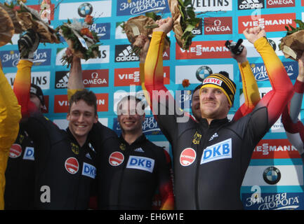 Winterberg, Germany. 08th Mar, 2015. Bob pilot Maximilian Arndt (r) and his pushers Alexander Roediger, Kevin Korona and Ben Heber from Germany celebrate their win after the 4th run during the award ceremony of the 4 men bobsleigh event at the Bob and Skeleton World Championships in Winterberg, Germany, 08 March 2015. Photo: INA FASSBENDER/dpa/Alamy Live News Stock Photo