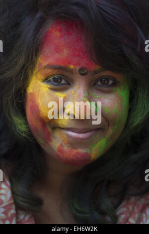 March 8, 2015 - Dhaka, Bangladesh - Dhaka, Bangladesh, 08 March 2015.Bangladeshi youth playing coloured powders during Holi celebrations at the Fine Arts Institute of Dhaka University. The Holi festival is celebrated to mark the onset of spring, with people from all walks of life coming out on the streets and applying coloured powder to anyone and everyone upon the advent of spring..Holi is the festival of colors, fun and frolic and is celebrated by millions of Hindus in the Indian subcontinent to welcome the spring..An ancient Hindu festival, Holi is marked as a triumph of good over evil, and Stock Photo