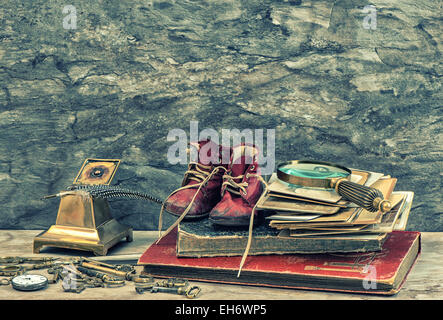 Antique books, photos, keys and writing accessories. Nostalgic still life. Vintage style toned picture Stock Photo