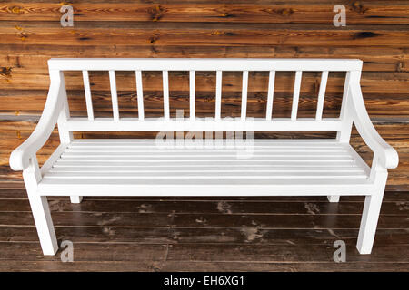 Old white wooden bench in abstract rural room interior Stock Photo