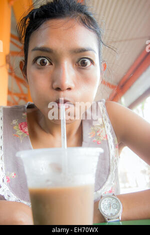 funny face girl drinks coffee Stock Photo