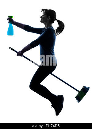 one  woman maid dust cleaning flying broom in silhouette studio isolated on white background Stock Photo