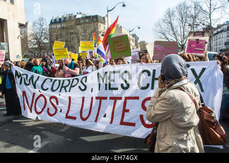 Paris, France. 8th March. Crowd of French Feminists Groups Marching in International Women's Day Demonstration, Belleville, women's activism Crowd with Protest Banners and Signs on Street, women rally, pro choice rally, pro abortion protest, demonstration activism france Stock Photo