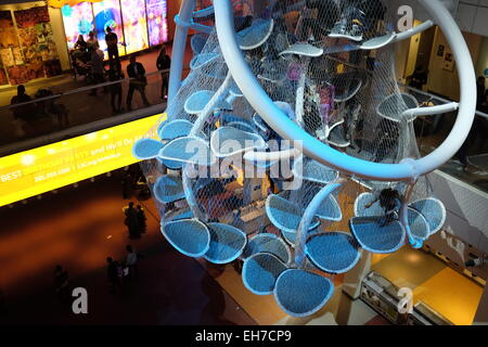Infinity Climber a suspended multi-story play space for children and adults hanging over Atrium floor of Liberty Science Center Stock Photo