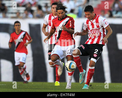 Buenos Aires, Argentina. 8th Mar, 2015. River Plate's Leonardo Ponzio (C) vies for the ball with Rolando Garcia of Union de Santa Fe during the match of the Argentinean soccer, held in the Monumental Stadium in Buenos Aires, Argentina, March 8, 2015. © TELAM/Xinhua/Alamy Live News Stock Photo