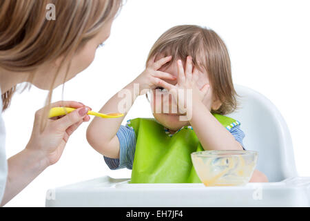Child boy refuses to eat closing face by hands Stock Photo
