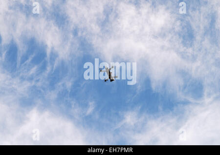 Multicopter with camera in flight. Stock Photo