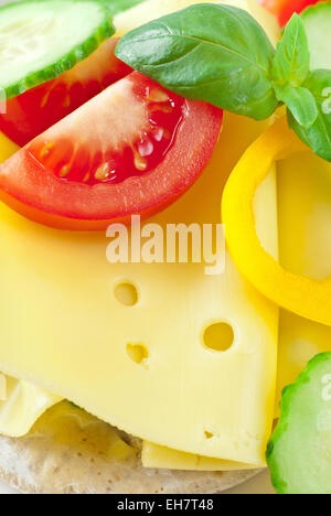 Cheese sandwich with tomato, yellow bell pepper and cucumber. Stock Photo