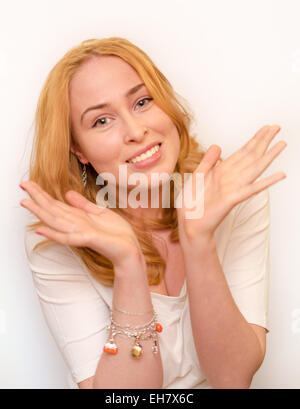 Portrait of happy smiling blond young caucasian woman showing ten fingers, isolated over white background Stock Photo