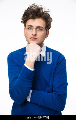Serious young business man in glasses over gray background Stock Photo