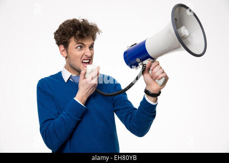 Man shouting through megaphone over gray background Stock Photo