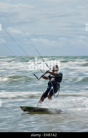 France, Quiberon beach activity close up of man on kite surf board blurred back ground Stock Photo