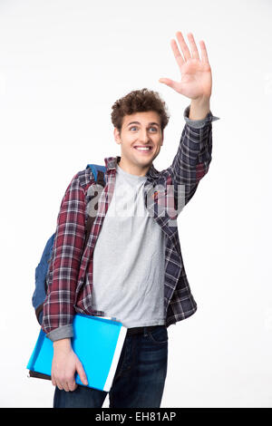 Happy young male student waving his hand Stock Photo