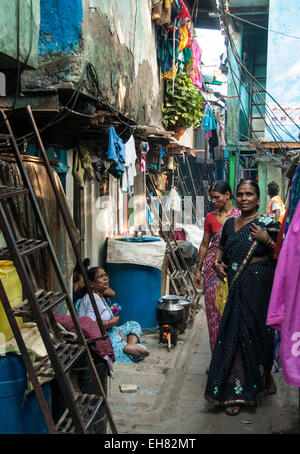 Narrow street and 2-layer houses, Colaba fishing village, southern end of Mumbai city, Maharashtra, India, Asia Stock Photo