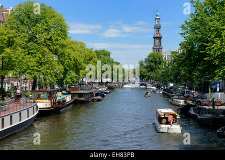 View along Prinsengracht canal, looking towards Westerkerk church, Amsterdam, North Holland, Netherlands, Europe Stock Photo