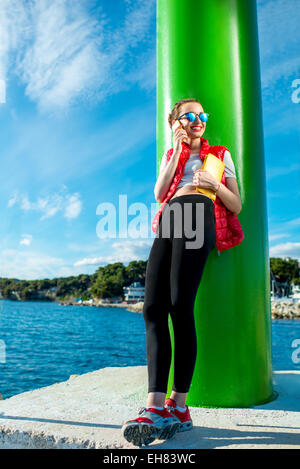 Sport woman with phone Stock Photo