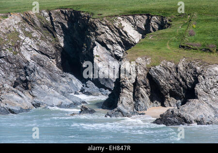 Rocky cliffs at Porth Joke near Newquay in Cornwall. Rugged coastal scenery in the South West England. Stock Photo