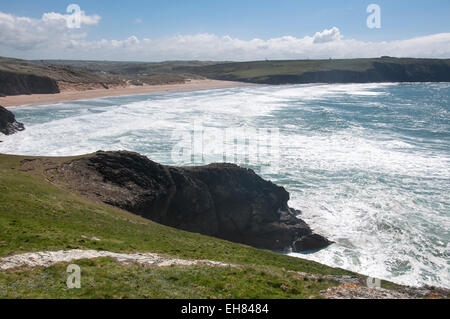 Holywell bay near Newquay in Cornwall. A bright and sunny spring day. View from the cliffs to the sea and beach. Stock Photo