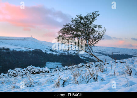 View across the snow covered Calder Valley to Stoodley Pike from high above Hebden Bridge, Calderdale, West Yorkshire, U Stock Photo
