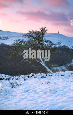 View across the snow covered Calder Valley to Stoodley Pike from high above Hebden Bridge, Calderdale, West Yorkshire, UK Stock Photo