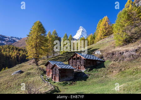 The Matterhorn seen from a little group of mountain huts by Zermatt, Swiss Canton of Valais, Swiss Alps, Switzerland Stock Photo