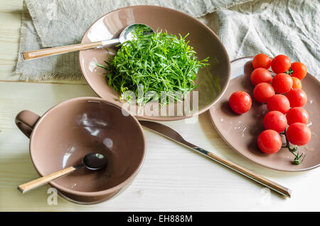 Ingredients watercress salad with cherry tomatoes. From series Natural organic food Stock Photo