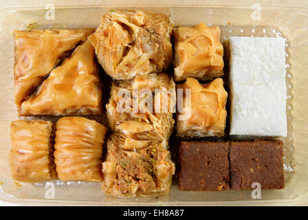 Variety of Turkish baklava in a plastic box Stock Photo