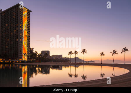 Rainbow Tower at Hilton Hawaiian Village Hotel at dawn, Waikiki, Oahu, Hawaii Stock Photo