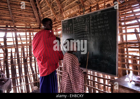 Maasai children at English lecture in the Ngorongoro Conservation Area in the Crater Highlands area of Tanzania Eastern Africa Stock Photo