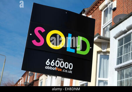 an estate agents sold board sign on a street in Exeter, Devon Stock ...