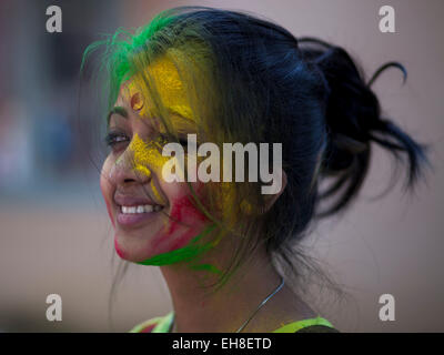 Dhaka, Bangladesh, 08 March 2015.Bangladeshi youth playing coloured powders during Holi celebrations at the Fine Arts Institute of Dhaka University. The Holi festival is celebrated to mark the onset of spring, with people from all walks of life coming out on the streets and applying coloured powder to anyone and everyone upon the advent of spring. Holi is the festival of colors, fun and frolic and is celebrated by millions of Hindus in the Indian subcontinent to welcome the spring. An ancient Hindu festival, Holi is marked as a triumph of good over evil, and has become popular among non-Hindu  Stock Photo