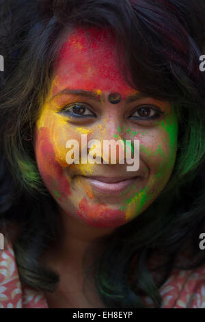 Dhaka, Bangladesh, 08 March 2015.Bangladeshi youth playing coloured powders during Holi celebrations at the Fine Arts Institute of Dhaka University. The Holi festival is celebrated to mark the onset of spring, with people from all walks of life coming out on the streets and applying coloured powder to anyone and everyone upon the advent of spring. Holi is the festival of colors, fun and frolic and is celebrated by millions of Hindus in the Indian subcontinent to welcome the spring. An ancient Hindu festival, Holi is marked as a triumph of good over evil, and has become popular among non-Hindu  Stock Photo