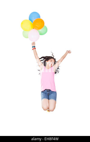 1 indian Young girl Teenager Jumping Flying Balloon enjoy Stock Photo