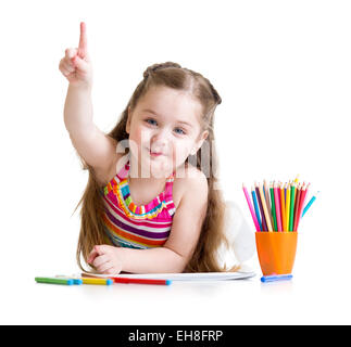 Happy little girl drawing with pencils in preschool Stock Photo