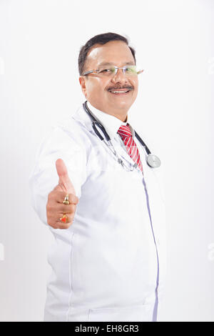 1 indian Senior Adult Man doctor Thumbs Up showing Stock Photo