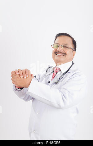 1 indian Senior Adult Man doctor standing Hands Clasped Stock Photo