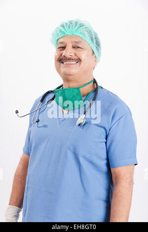An Indian old man standing with surgical mask on during covid-19 ...