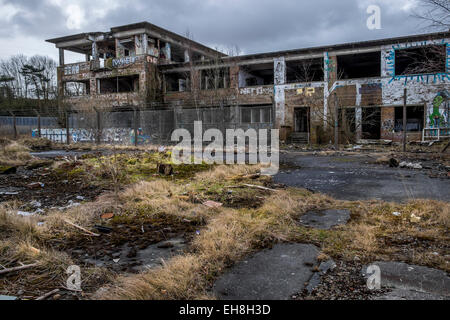 Disused and derelict power station with graffiti on all walls and debris on the floor  a very dangerous place. Stock Photo