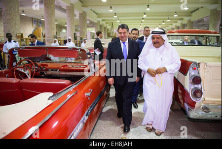 Doha, Qatar. 09th Mar, 2015. German Minister of Economics and Energy and Vice Chancellor of Germany, Sigmar Gabriel (L, SPD) and Sheikh Faisal Bin Qassim Al Thani (R) visit the Sheikh Faisal Museum in Doha, Qatar, 09 March 2015. The museum houses Sheikh Faisal's valuable private collection of unique objects, like Islamic manuscripts, archeological finds, textiles, carpets, embroideries, furniture and vintage cars. Gabriel and a big economic delegation are on a trip for talks in the gulf region until 10 March 2015. PHOTO: BERND VON JUTRCZENKA/dpa/Alamy Live News Stock Photo