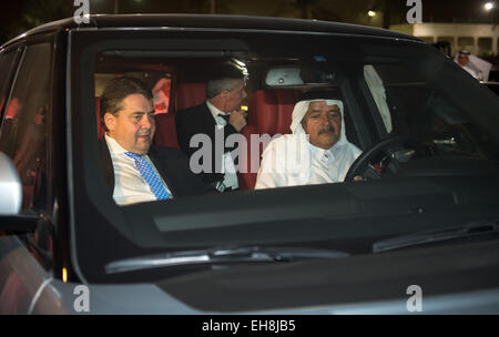German Minister of Economics and Energy and Vice Chancellor of Germany, Sigmar Gabriel (L, SPD) and Sheikh Faisal Bin Qassim Al Thani (R) drive to their dinner location after visiting the Sheikh Faisal Museum in Doha, Qatar, 09 March 2015. The museum houses Sheikh Faisal's valuable private collection of unique objects, like Islamic manuscripts, archeological finds, textiles, carpets, embroideries, furniture and vintage cars. Gabriel and a big economic delegation are on a trip for talks in the gulf region until 10 March 2015. PHOTO: BERND VON JUTRCZENKA/dpa Stock Photo