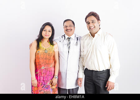 3 indian people doctor and Married Couple Health Treatment Stock Photo