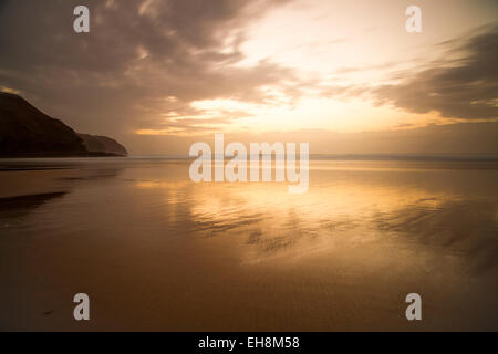 Sunset on a beach in Perranporth, Cornwall. Stock Photo