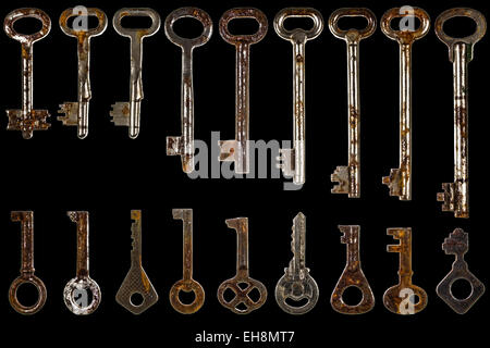 Set of old keys, isolated on black background Stock Photo