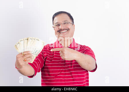1 indian Seniors Adult man money showing finger pointing Stock Photo