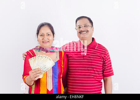 2 indian Seniors Married couples money showing Stock Photo