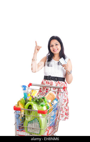 1 indian Adult woman Trolley Showing online Shopping finger pointing Stock Photo