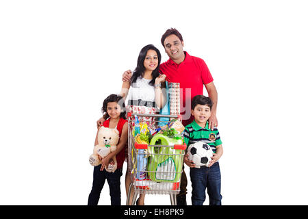 4 indian kids and Parents Trolley Shopping Stock Photo